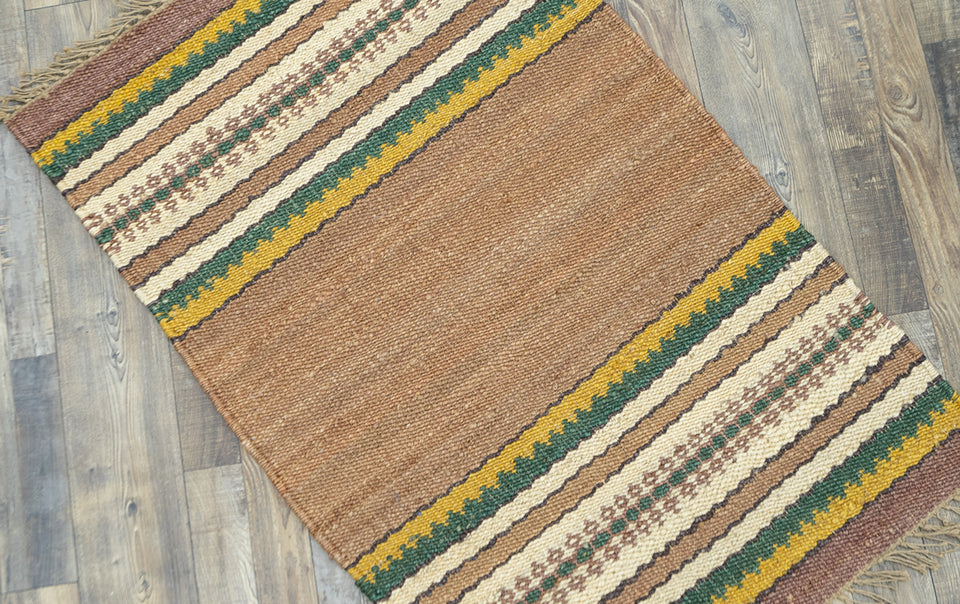 ezra natural green baided rug
